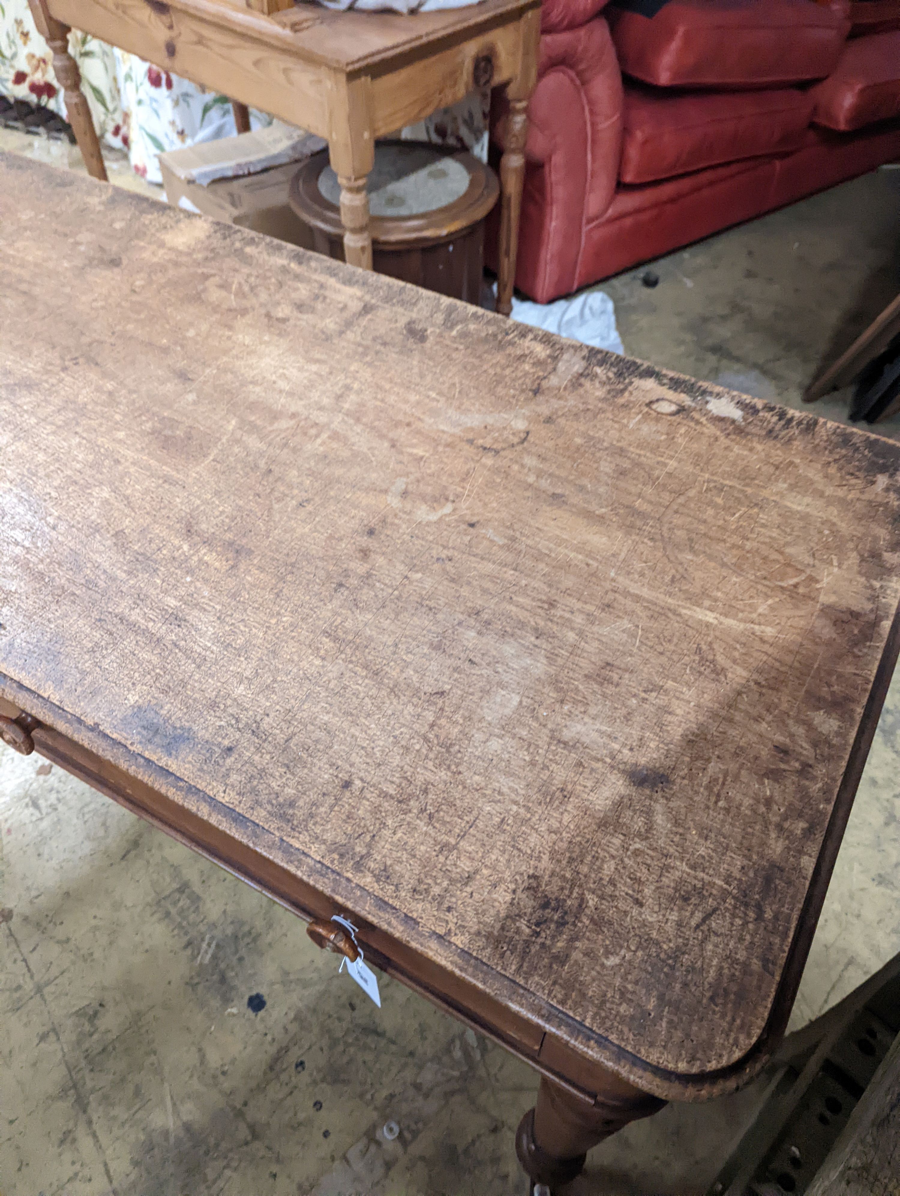 A Victorian mahogany two drawer writing table, length 136cm, depth 57cm, height 76cm